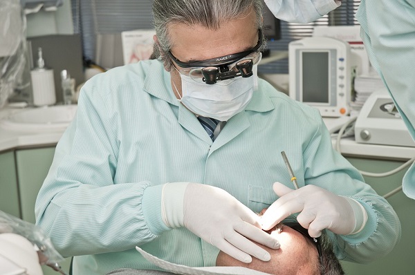 dentist tending to a patient