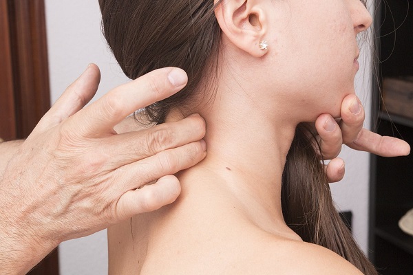 woman getting help with neck pain